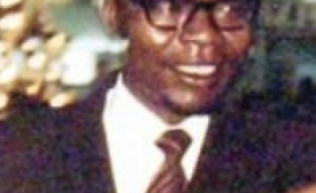 In this image of Barack Obama Sr. with young Obama light from the background bleeds into Barack Obama Sr.'s neck just below his right ear. (CLICK TO ENLARGE)