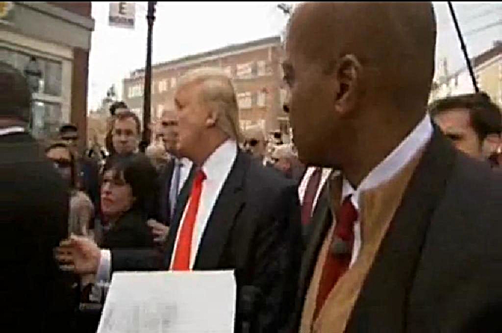 New Hampshire, April 27, 2011 NBC News reporter Ron Allen attempts to show Donald Trump “the document”, a piece of paper he was holding which NBC News portrayed as President Obama’s Hawaii “Certificate of Live Birth.” It remains unclear how one of only two “official” copies that an attorney couriered from Honolulu to the White House hours earlier could have landed in the hands of Allen in New Hampshire. (Image credit: NBC News)