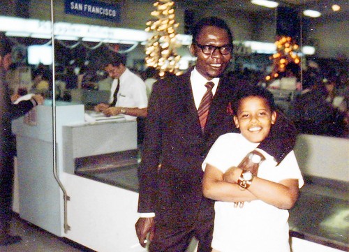 Image of Barack Obama Sr., alleged father of President Obama, with his left 'arm' wrapped around young Barack Obama, allegedly taken at the Honolulu International Airport. Obama Sr.'s fingernails appear white.