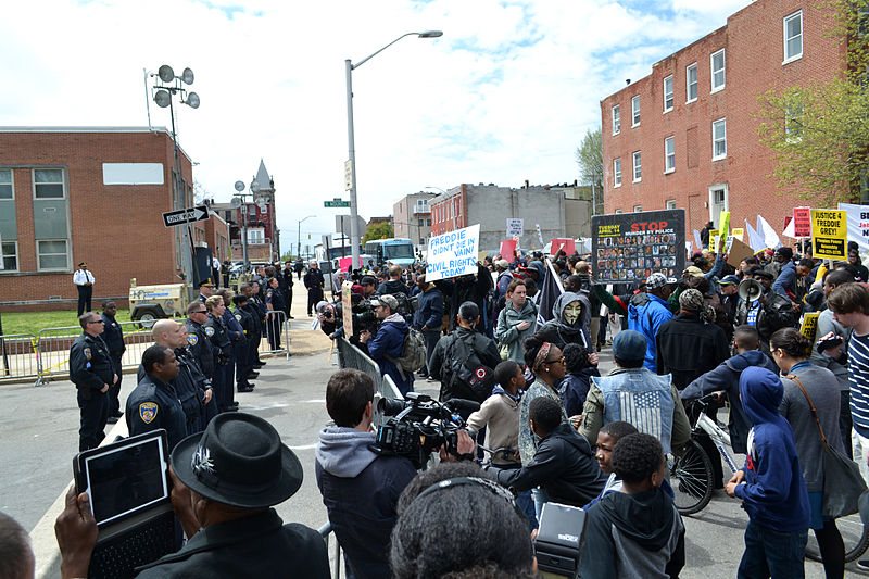 BALTIMORE, MD - April 25: Protest at the Baltimore Police Department Western District building at N. Mount St. and Riggs Ave. (Image credit: Veggies/Wikimedia Commons)