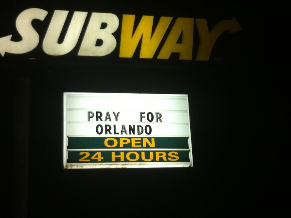 ORLANDO, FL JUNE 12, 2016 - The Subway store near Pulse night club provided parking for some of the countless news trucks and added the words "PRAY FOR ORLANDO" to their sign.  Image credit: 1776 Channel