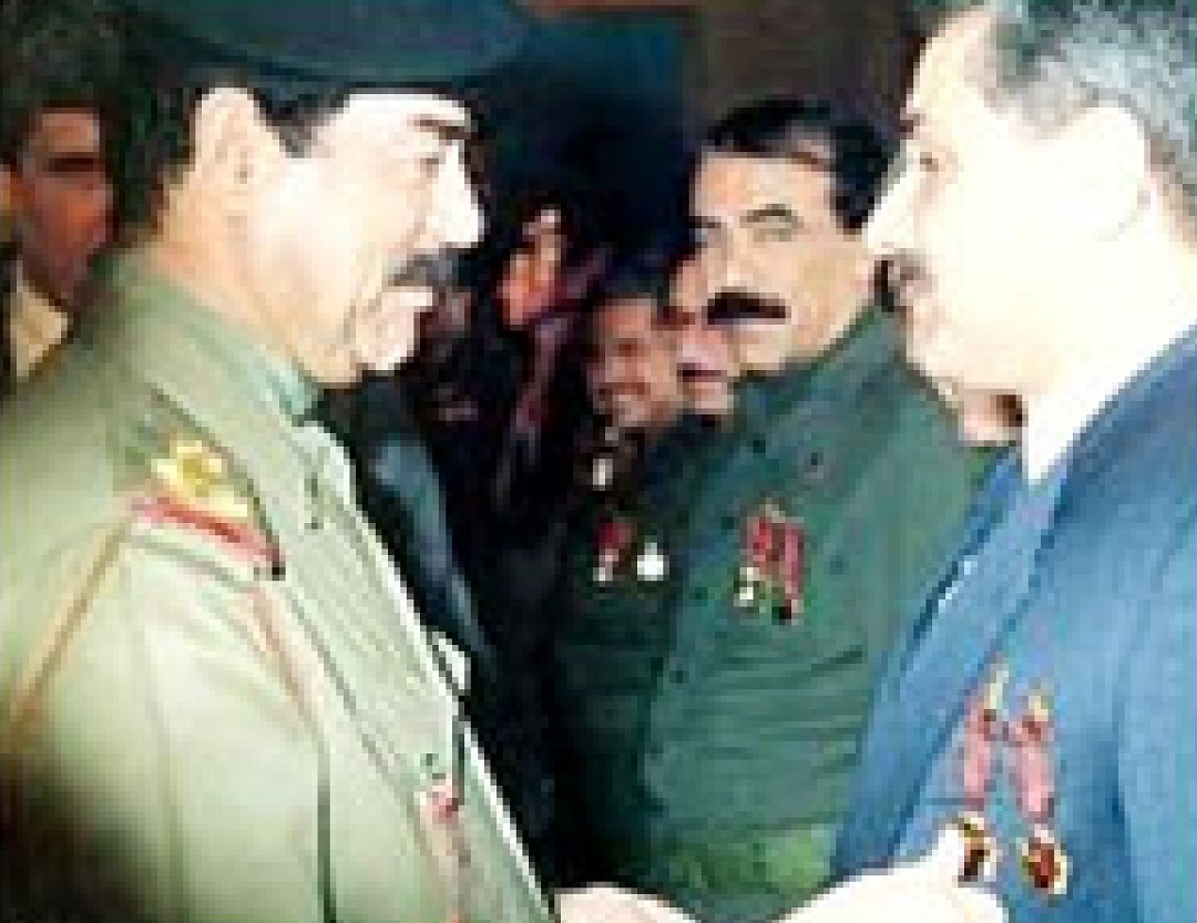 Iraqi dictator Saddam Hussein pins medals on the chest of nuclear physicist Dr. Jafar Dhia Jafar, the architect of Iraq's nuclear weapons program.
